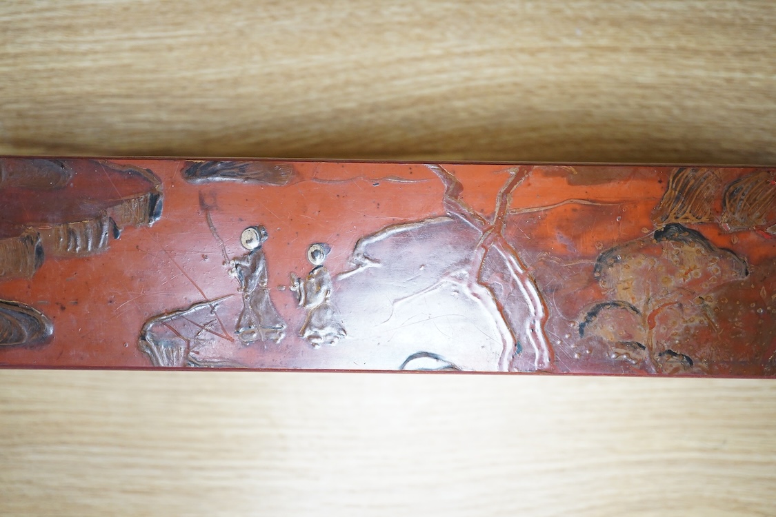 A Chinese red lacquered stand, 39cm wide